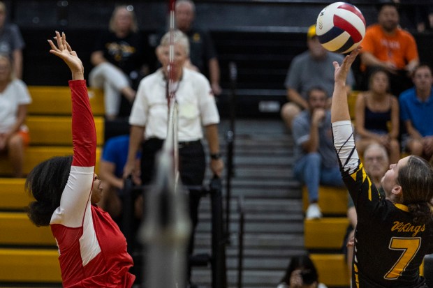 St. Laurence's Mckenna Rake (7) tips the ball over the net against Homewood-Flossmoor during a nonconference game in Burbank on Thursday, Sept. 12, 2024. (Vincent D. Johnson / Daily Southtown)