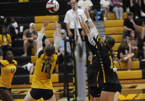 Marian Catholic's Kaitlyn Nichols (10) tries to get the ball past St. Laurence's Aubrey Martinez (1) during a nonconference match Wednesday, Sept. 4, 2024 in Burbank, IL. (Steve Johnston/Daily Southtown)