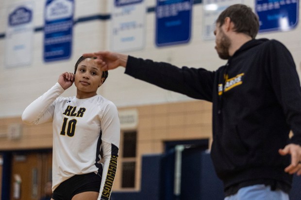 Richards' Peyton Craan (10) listens to head coach Nicholas Costa during a South Suburban Red game against Reavis in Burbank on Thursday, Sept. 19, 2024. (Vincent D. Johnson / Daily Southtown)