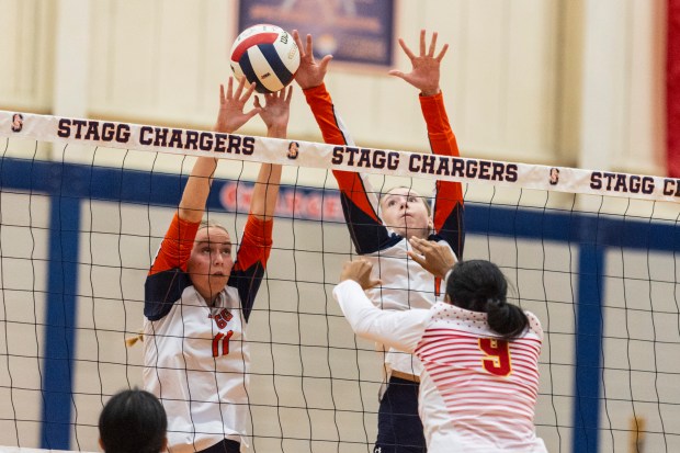 Stagg's Maggie Ziel (11) and Stagg's Katriana Zumerchik (1) go up to block a Tinley Park attack during a nonconference game in Palos Hills on Monday, Sept. 16, 2024. (Vincent D. Johnson / Daily Southtown)