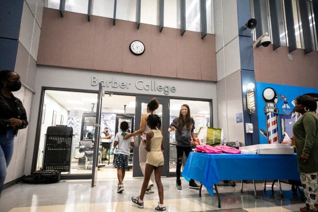 Children and adults showed up for free haircuts Aug. 17, 2024, at the Barber College at South Suburban College in South Holland. (Vincent D. Johnson/for the Daily Southtown)