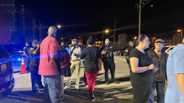 Harvey police officers block residents from the entrance to City Hall after a council meeting ended Sept. 9, 2024. (Samantha Moilanen/Daily Southtown)