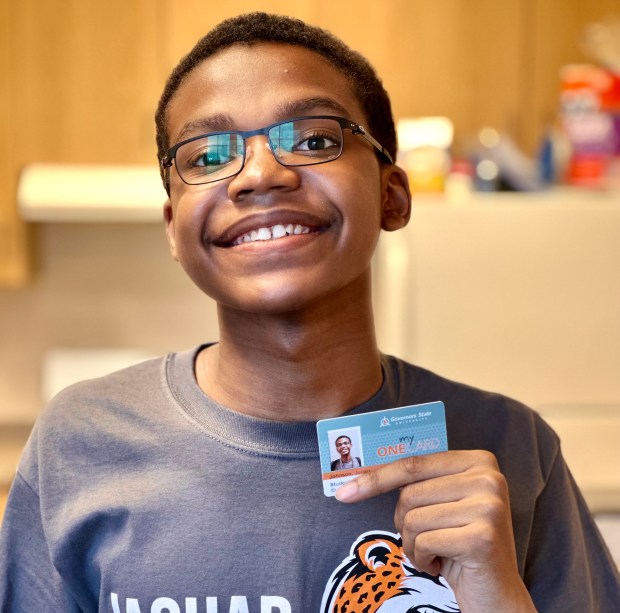 Julian Johnson shows off his Governors State University ID, which is an important component of the inclusivity of the Jaguar Jumps program. (Daphney Kennedy-Johnson)