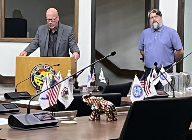 Attorney Kevin Gosewisch tells Will County officials Sept. 3, 2024, about the home of his client Darius Marciukaitis, right, under construction in New Lenox Township. (Michelle Mullins/for the Daily Southtown)