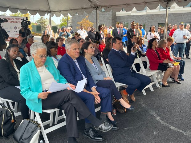 Veterans, elected officials and housing authority representatives gather Sept. 13, 2024, in Chicago Heights to celebrate the opening of a housing development for veterans. (Samantha Moilanen/Daily Southtown)