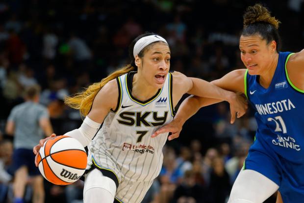 Sky guard Chennedy Carter (7) drives around Lynx guard Kayla McBride (21) in the third quarter on Sept. 13, 2024, in Minneapolis. (Bruce Kluckhohn/AP)