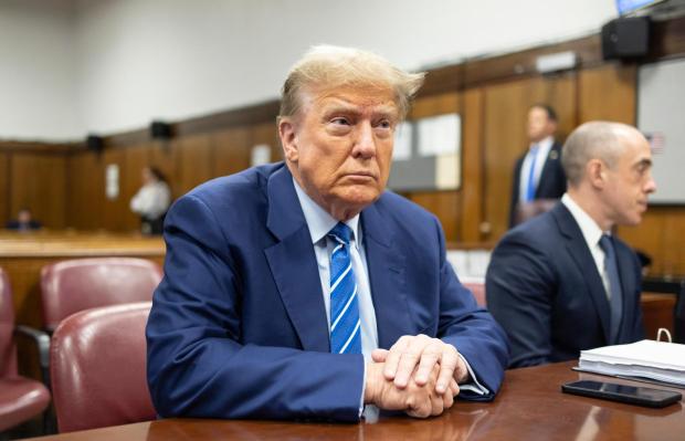 Former President Donald Trump awaits the start of proceedings on the second day of jury selection at Manhattan criminal court, April 16, 2024, in New York. (Justin Lane/Pool Photo via AP)