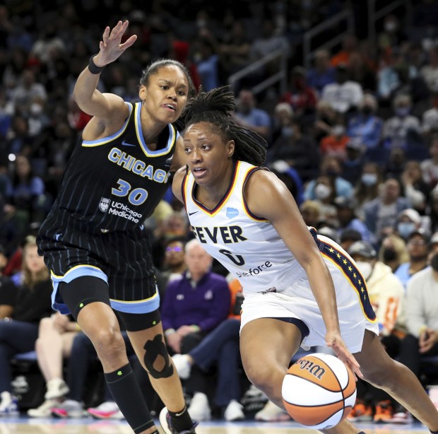 Indiana Fever guard Kelsey Mitchell (0) goes in for a layup while Chicago Sky forward Azurá Stevens (30) defends on May 24, 2022, at Wintrust Arena.