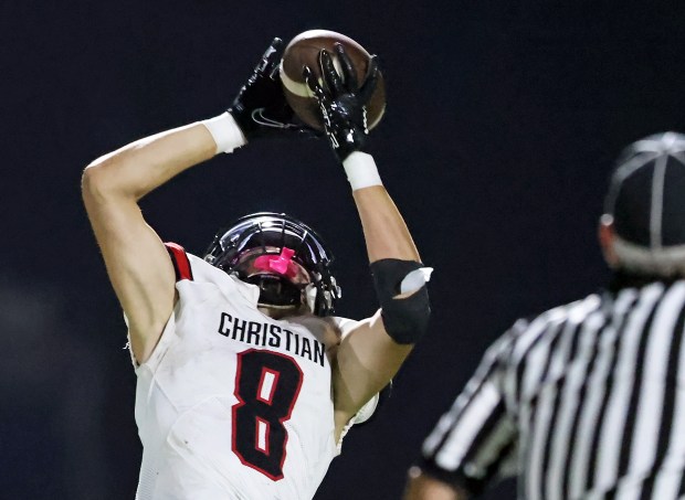 Aurora Christian's Jonan Miceli (8) catches a pass from Jalen Carter in the third quarter during a Chicagoland Christian Conference game in Elgin on Friday, Sept. 15, 2023.