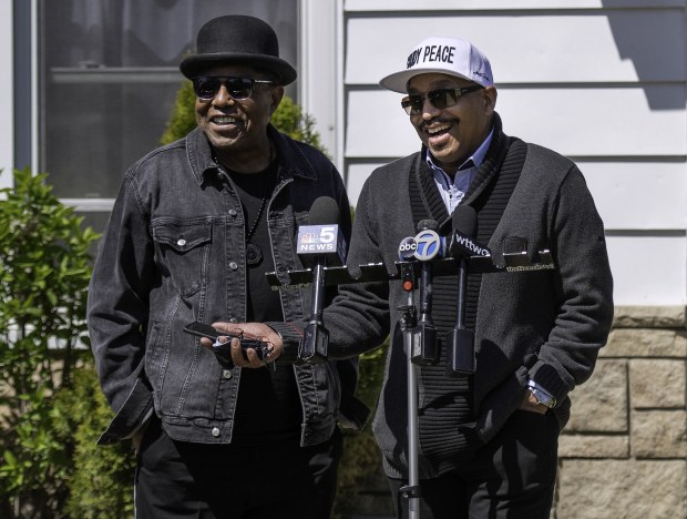 Tito Jackson, left, and his brother, Marlon Jackson, speak at the Jackson family home in Gary on Thursday, May 13, 2021. The two, along with brother Jackie, have endorsed Eddie Melton in Gary's mayoral primary. (Michael Gard/Post-Tribune)