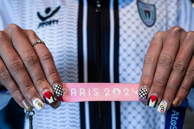 Palestinian American Olympic swimmer Valerie Tarazi displays her painted nails before the start of the 2024 Paris Olympic Games on July 27, 2024. (Daniel Berehulak/The New York Times)