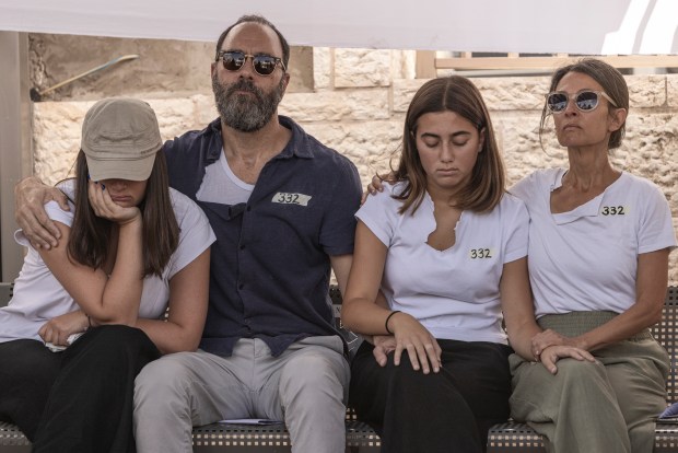 Jonathan Polin, second from left, and Rachel Goldberg-Polin, right, parents of Hersh Goldberg-Polin, attend his funeral in Jerusalem on Sept. 2, 2024. Goldberg-Polin, a dual Israeli American citizen, was one of six hostages who were found dead in a tunnel in southern Gaza on Sept. 1, 2024. (Avishag Shaar-Yashuv/The New York Times)