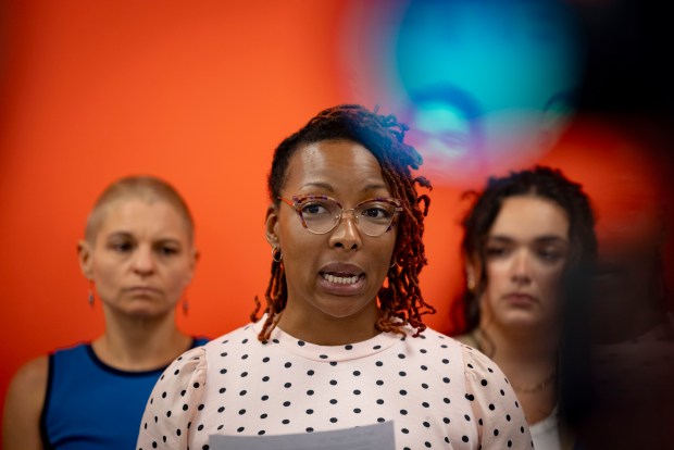 Dominique Ward speaks about the years of electronic harassment by the father of her children on July 11, 2024, at the offices of Ascend Justice. (Brian Cassella/Chicago Tribune)