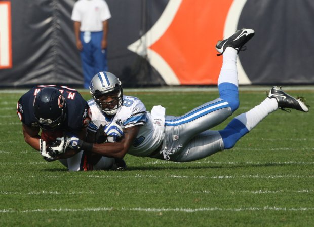 Bears' Mike Brown intercepts the ball in front of Detroit Lions' Calvin Johnson in first half at Soldier Field on Sunday, Nov. 2, 2008. (Nuccio DiNuzzo/Chicago Tribune)