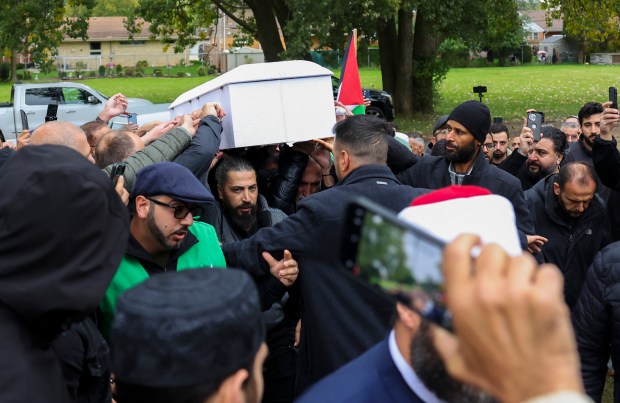 Oday Alfayoumi and others carry the casket of his son, Wadee Alfayoumi, to the burial at Parkholm Cemetery in La Grange Park on Monday, Oct. 16, 2023. (Eileen T. Meslar/Chicago Tribune)