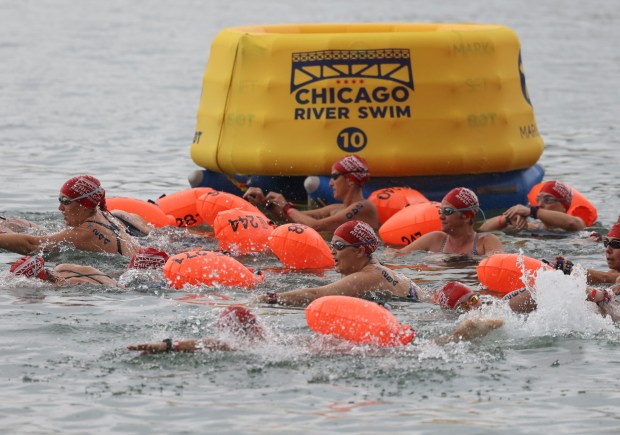 Swimmers start their race in the water off Ohio Street Beach on Sunday, Sept. 22, 2024. (Brian Cassella/Chicago Tribune)