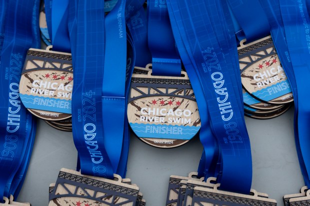 Medals are prepared for finishers Sunday, Sept. 22, 2024. (Brian Cassella/Chicago Tribune)