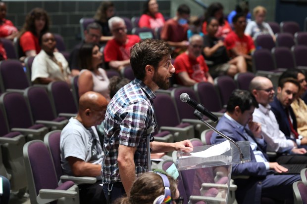 Jackson Potter, Vice President of the Chicago Teachers Union, addresses the Chicago Board of Education at William Jones College Preparatory school in Chicago, July 16, 2024. (Terrence Antonio James/Chicago Tribune)