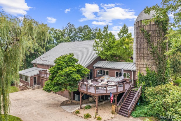 This former dairy barn at 51 Chippewa Drive in Oswego has six bedrooms, including two primary suites, as well as an elevator. (Creative Light Studios)