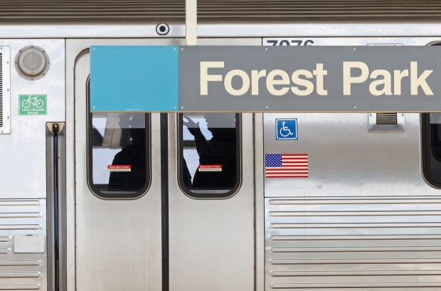 Police investigators work inside a CTA Blue Line train parked at the Forest Park station on Sept. 2, 2024. Four passengers were fatally shot between the Austin and Forest Park stations early Monday, police say. (John J. Kim/Chicago Tribune)