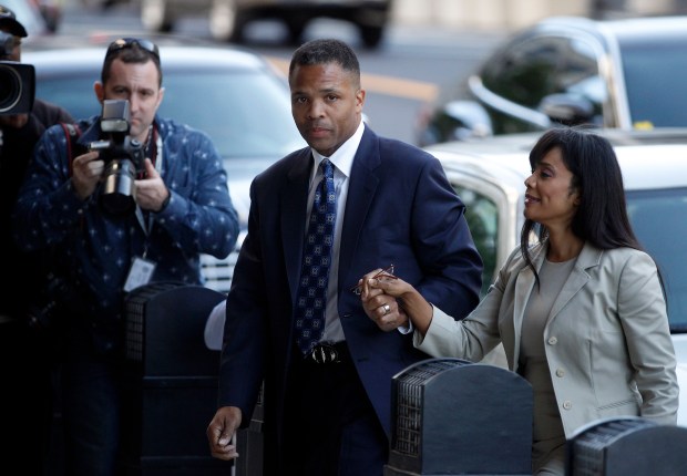 Jesse Jackson Jr. and his wife, Sandi Jackson, arrive for their sentencing hearing, Aug. 14, 2013, at the Prettyman Federal Courthouse in Washington. (Brian Cassella/Chicago Tribune)