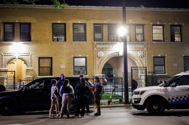 Officers respond to a call for service after a group of migrants with weapons and motorcycles were reported in a residential building's courtyard in the 6100 block of South King Drive on Monday, Sept. 2, 2024, in Chicago. No police report was generated from the call. (Armando L. Sanchez/Chicago Tribune)