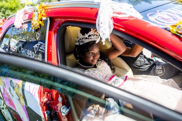 Callia Muhammad, 11, Queen of Distinction and Miss Chicago for the American Royal Beauties Pageant, prepares Aug. 31, 2024, for the 2024 Chicago Labor Day Parade in the Pullman neighborhood. (Tess Crowley/Chicago Tribune)