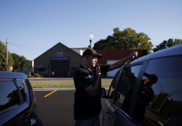 Matt Rowlee, 42, outreach specialist with the Perfectly Flawed Foundation, talks on the phone while out delivering harm reduction and overdose prevention supplies on Sept. 4, 2024, in Princeton, Illinois. (Armando L. Sanchez/Chicago Tribune)