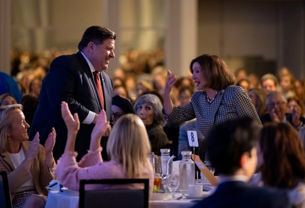 Gov. JB Pritzker and former U.S. House Speaker Nancy Pelosi are recognized during the annual luncheon for Personal PAC, an abortion rights advocacy organization, on Sept. 23, 2024, at the Chicago Hilton. (Brian Cassella/Chicago Tribune)