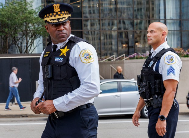 Police Superintendent Larry Snelling, left, walks past officers while activists gather near North Michigan Avenue to protest the Democratic National Convention, Aug. 18, 2024. (Armando L. Sanchez/Chicago Tribune)