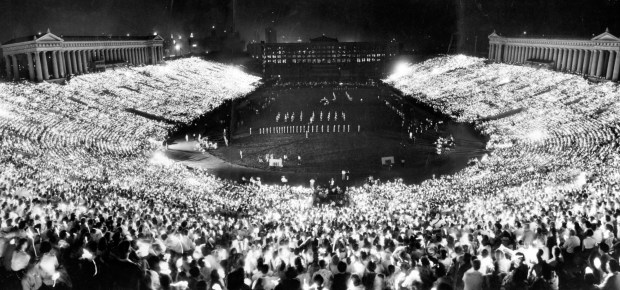 Spectators hold up matches to light up Soldier Field during a ceremony that is the highlight of the Chicagoland Music Festival in 1961. (Chicago Tribune historical photo)