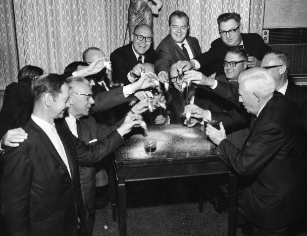 Thirteen members of the Anti-Superstition Society pour salt while they drink on Oct. 13, 1967, in Chicago. The members are, from left, Jack Goldthwaite, Ed Welter, Joseph Kostner, Lew Regan, Les Lear, Mike Kilgore, Harry Puccetti, Ben Regan Jr., Judge Thomas Kluczynski, Ed Harrington, Walter Zawislak, Joe Regan and Tom Sexton. (William Bender/Chicago Tribune)