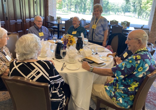 Members of the Waukegan High School Class of 1954 talk at their reunion last week. (Steve Sadin/For the Lake County News-Sun)