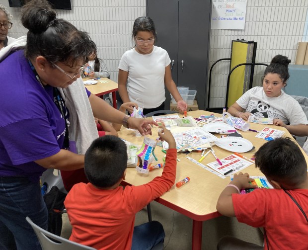 Youngsters create paper lanterns in the new Panda Cares Center of Hope at the Boys and Girls Club of Lake County in Waukegan. (Steve Sadin/For the Lake County News-Sun)