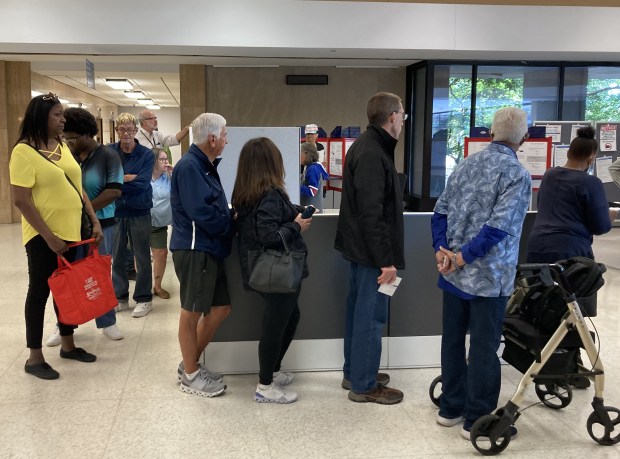 People stand in line to cast ballots on the first day of early voting in Lake County. (Steve Sadin/For the Lake County News-Sun)