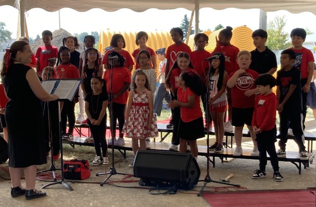 The Forrestal Elementary School choir sings at the groundbreaking for the new building. (Steve Sadin/For the Lake County News-Sun)