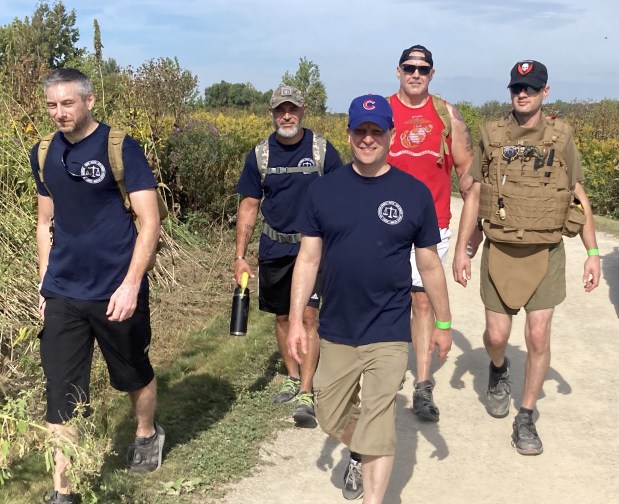 Riley McGovern, far right, wore a full pack during the eighth-annual Ruck March for Suicide Prevention. (Steve Sadin/For the Lake County News-Sun)