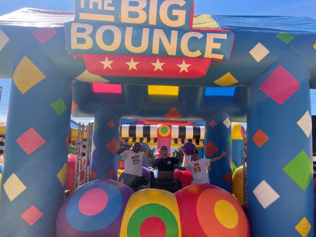 Three DJ's man the music at the 26,000-square-foot bounce house named The Castle at the Big Bounce America's tour stop in Skokie on Aug. 31. The Castle is the world's biggest bounce house, according to a Big Bounce America tour manager.(Richard Requena)