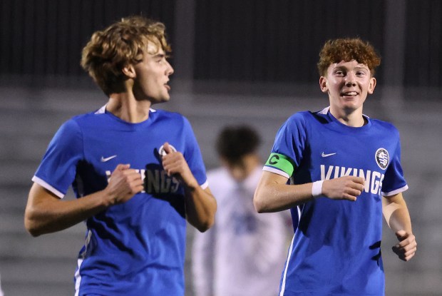 Geneva's Jack Hatton, left and Reece Leonard react to Leonard's goal during a non conference game against Larkin Thursday, Oct. 3, 2024 in Geneva. (H. Rick Bamman / The Beacon News)