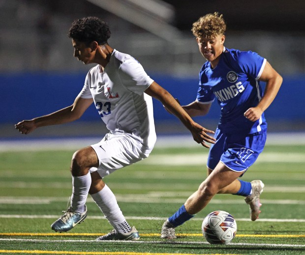 Geneva's Benjamin Murphy (17) seals the ball from Larkin's Jose Vieyra (23) during a non conference game Thursday, Oct. 3, 2024 in Geneva. (H. Rick Bamman / The Beacon News)