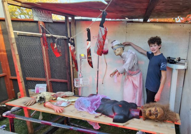 John Doorn, 13, of Elburn, shows off one of the rooms he helped develop at his uncle's circus-themed haunted house in Elburn. The haunted house is expected to draw about 4,000 visitors by Halloween. (David Sharos / For The Beacon-News)