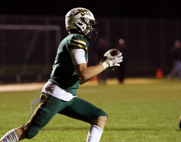 Waubonsie Valley's Owen Roberts runs the ball against Dekalb during a game in Aurora on Friday, Oct. 11, 2024. (James C. Svehla / for the Beacon-News)