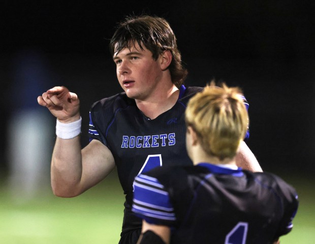 Burlington Central's Jackson Alcorn (4) discusses a play with Zane Pollack (1) in the second quarter during a Fox Valley Conference game in Burlington on Friday, Oct. 18, 2024.(H. Rick Bamman / The Beacon-News)