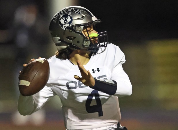 Oswego East's Niko Villacci sets to throw in the first half against West Aurora during a Southwest Prairie conference game on Friday, Oct. 6, 2023 in Aurora. Oswego East won, 14-13.H. Rick Bamman / For the Beacon-News