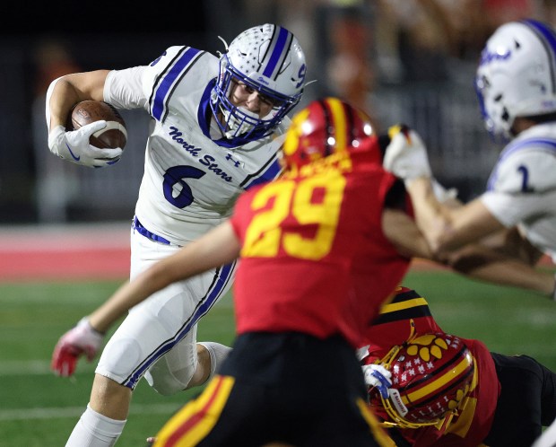 St. Charles North's Keaton Reinke (6) runs for a first down in the third quarter against Batavia in the quarter during a DuKane Conference game on Friday, Sept. 20, 2024 in Batavia.H. Rick Bamman / The Beacon-News