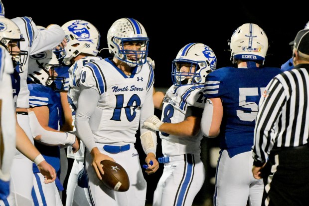 St. Charles North quarterback Ethan Plumb (10) celebrates his touchdown against Geneva on Friday, Oct. 25, 2024. (Mark Black / for the Beacon-News)