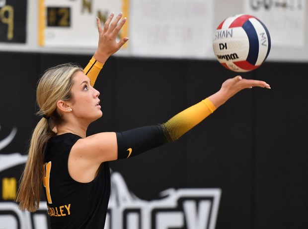 Metea Valley's Kelly McGrath serves during a match against Geneva on Wednesday, Oct. 16, 2024 in Aurora...(Jon Cunningham/for The Beacon-News)