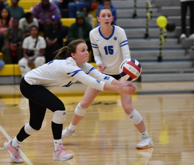 Geneva's Bridget Feichter saves the ball as Fiona Turnbull watches during a match against Metea Valley on Wednesday, Oct. 16, 2024 in Aurora...(Jon Cunningham/for The Beacon-News)