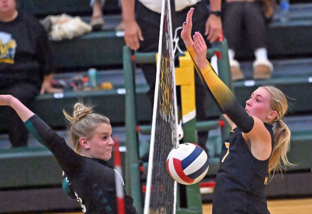 Waubonsie Valley's Chloe Gollaher blocks a shot by Metea Valley's Katie Schuele for a point. Waubonsie Valley defeated Metea Valley in girls volleyball, Thursday, Oct. 10, 2024, in Aurora, Illinois. (Jon Langham/for the Beacon-News)