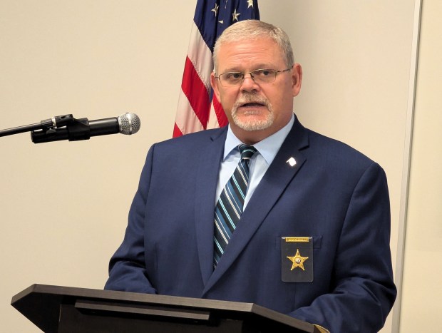 At a press conference on Thursday, Kane County Coroner Rob Russell announces the identity of the person whose skull was found behind the wall of a home in Batavia in the 1970s. (R. Christian Smith / The Beacon-News)